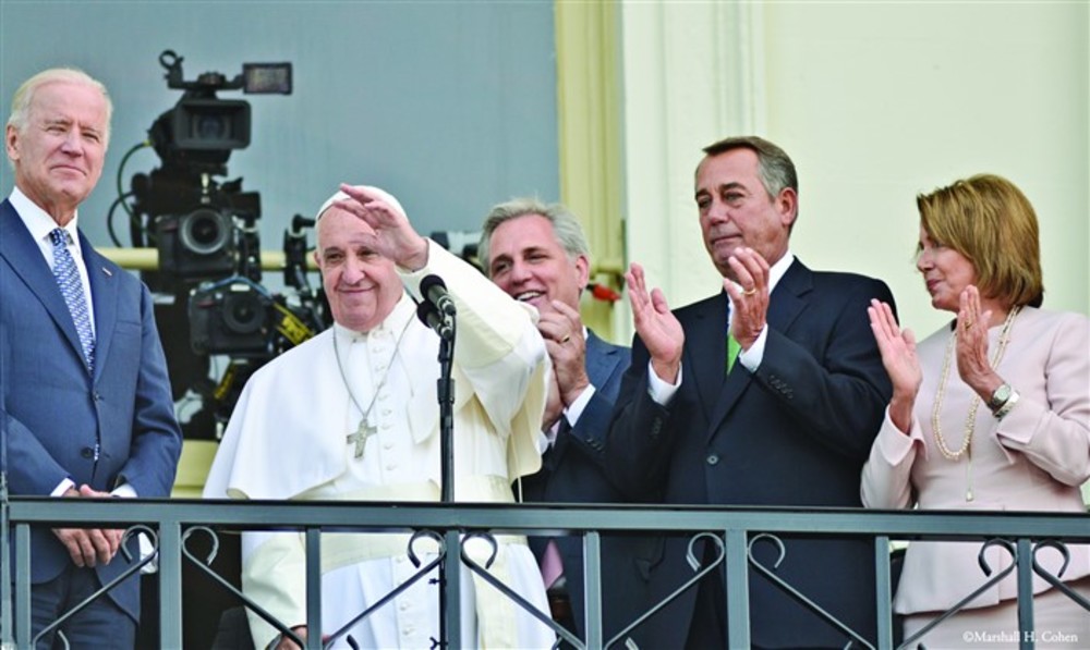 Pope Francis greeted members of Congress, their families, and thousands on the Mall of the U.S. Capitol following his speech before a joint meeting of Congress Sept. 24. He was accompanied on the Speaker’s Balcony by Vice President Joe Biden (far left), House Majority Leader Kevin McCarthy, and Speaker of the House John Boehner and Nancy Pelosi.  The following day, Boehner announced his resignation from both his leadership  and House seat mid-term, effective Oct. 30. /Marshall H. Cohen